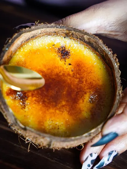 The perfect crack of caramelized sugar on our Crème Caramel. This dessert is a testament to our mastery of classic techniques and our commitment to using high-quality ingredients.