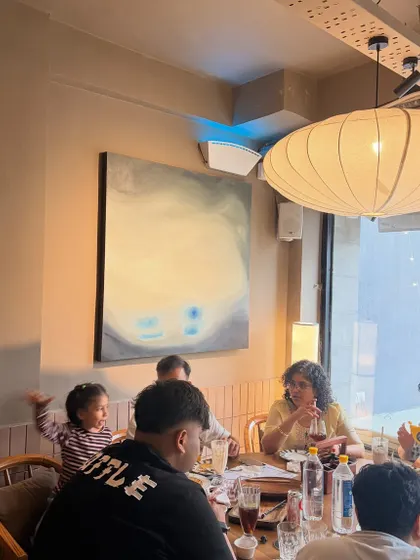 Another shot from the Lucknow cafe, where a family is dining next to one of my artworks. Seeing my art become part of people's daily lives is the best feeling.