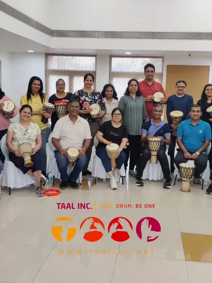 A happy group photo after a successful leadership training drum circle. You can see the sense of accomplishment and camaraderie that comes from creating something powerful together.
