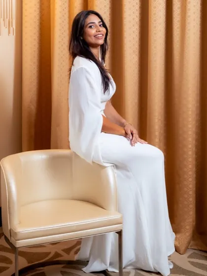 Sapthami Gowda looking radiant in the custom white cape gown we created for her award-winning night.