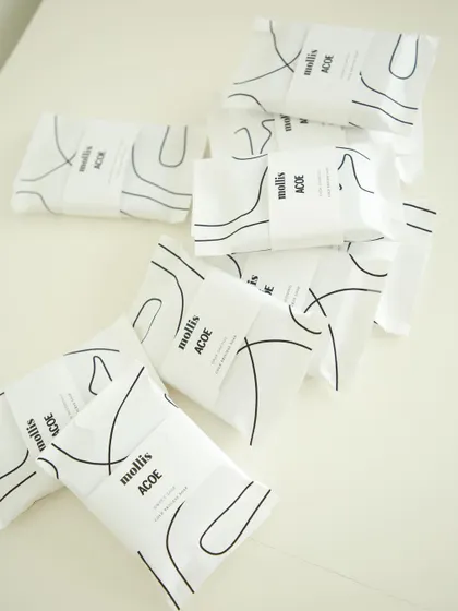 A playful arrangement of the corporate gift soaps for Airbnb, highlighting the abstract line-art packaging.