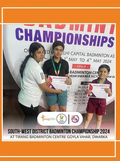 A coach presents medals to the winners at the South West District Championship. These tournaments are a culmination of months of hard work and dedication.
