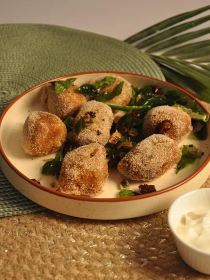 This is my Mushroom Rawa Fry, a coastal-inspired dish. The mushrooms are coated in a seasoned semolina mixture and fried until crisp, offering a wonderful texture and flavor.