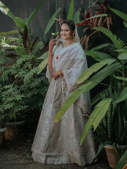 A full-length portrait of the bride, Zainab, looking radiant in her stunning Nikah attire.