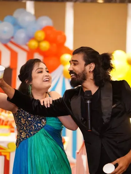 Sharing a laugh with a guest on stage after a successful trick.