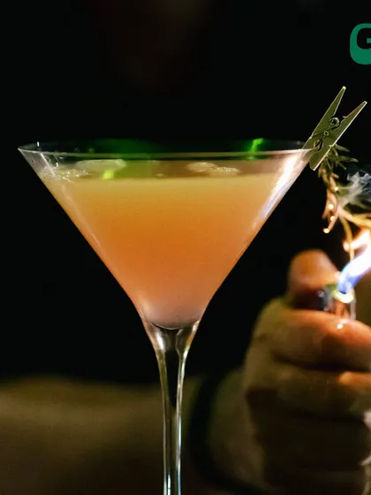 Our bartender adds a touch of fire to this cocktail, creating a smoky aroma and a bit of drama.