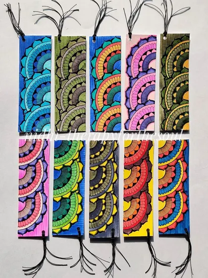 A set of bookmarks with a colorful, repeating semi-circle pattern. Each one is unique.
