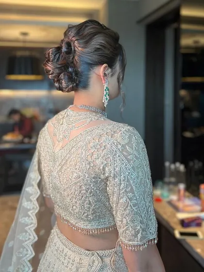 A final look at the modern messy bun, a perfect style for a chic evening event.