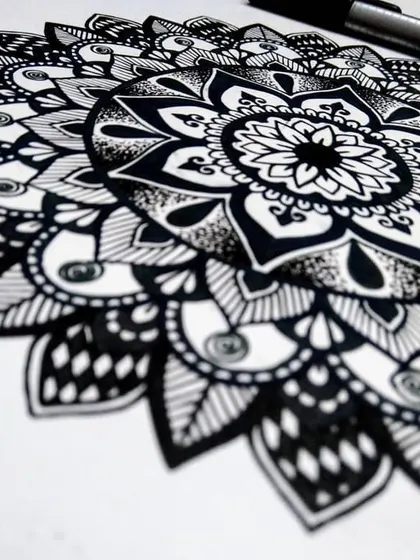 An angled shot of my floral mandala, highlighting the depth created by using different patterns and line weights. These designs are perfect for creating a calming atmosphere.