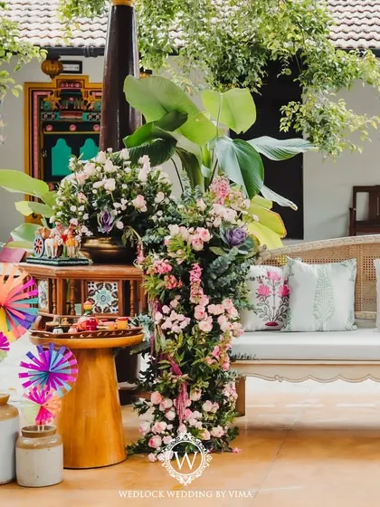 A closer look at the carnival-themed Mehendi decor. We used custom-printed cushions, lush floral cascades, and colorful pinwheels to create a festive and whimsical atmosphere.
