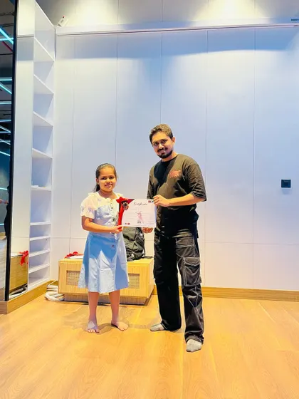 Students of all ages receiving their achievement certificates. My programs are structured to provide a clear path of progression for every dancer.