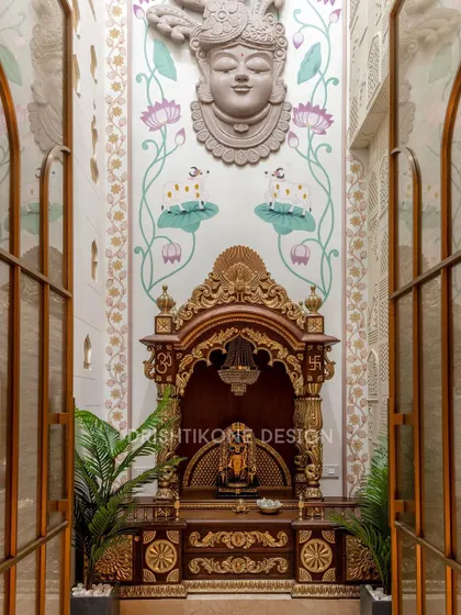 This double-height mandir is a testament to our dedication to creating spiritually uplifting spaces. We designed a traditional wooden temple with gold accents, set against a hand-painted mural of Shrinath Ji, to create a grand and peaceful sanctuary.