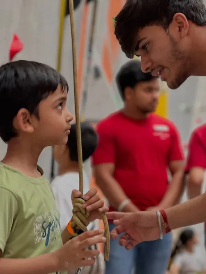 A coach gives some last minute advice to a young competitor. The sense of community and mentorship is strong, especially during our events.