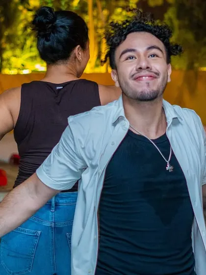 A dancer striking a pose for the camera with a huge smile. We love the confidence and personality our community brings.