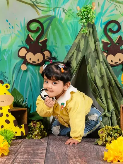 This little explorer is on the move, crawling through her jungle scene with a look of curiosity.