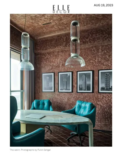 An Elle Decor feature on "The Party Pad," highlighting the cabin office. The design fuses functionality with high style, creating a space that works for both business and pleasure.