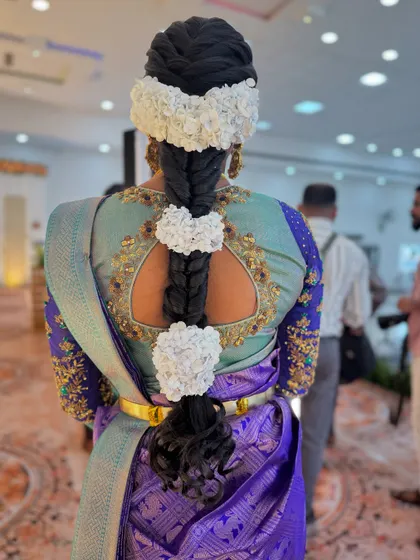 A unique and creative take on the traditional floral braid. For my bride Abi's reception, I used jasmine flowers to create beautiful heart shapes along the length of her braid.