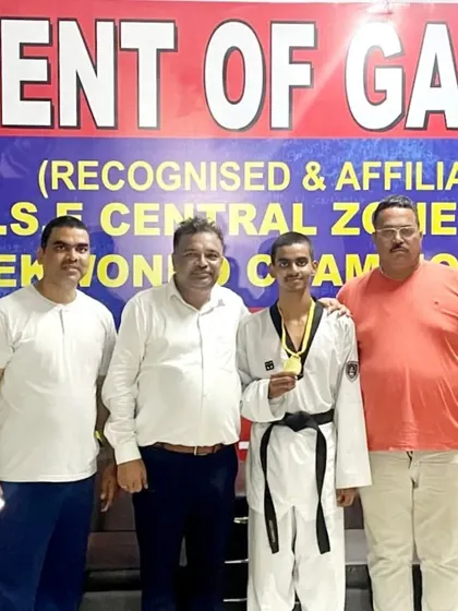 Celebrating Ansh Sharma's gold medal win at the CBSE Central Zone championship with officials. It's a proud moment for the entire academy.