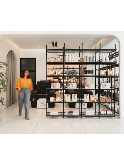 Another view of the versatile shelving unit, which acts as a porous boundary in the open-plan layout.