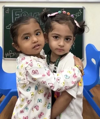 A warm embrace between two friends. We believe that fostering strong, positive friendships is a cornerstone of a happy and healthy childhood.
