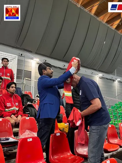 A moment of mutual respect, presenting a Sudeva scarf at the MTU Cup. We believe in building goodwill and strong relationships within the global football community.