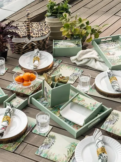 We create cohesive lifestyle collections that bring a theme to life. This outdoor tablescape features our Savanna-themed series, including matching placemats, trays, and napkin holders, perfect for creating a sophisticated and coordinated hosting experience.