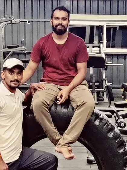 A candid moment with a friend and fellow fitness enthusiast at the gym.