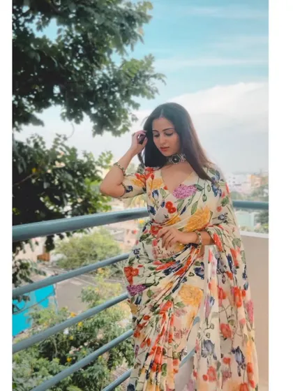 A beautiful floral chiffon saree with a multi-color print, perfect for a garden party or a summer event.