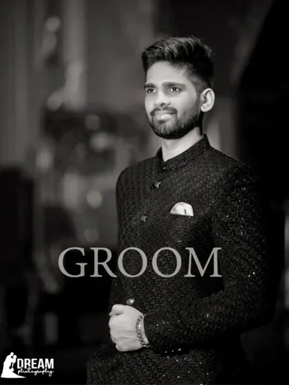 A classic black and white portrait of the handsome groom, Shitiz, at his engagement.
