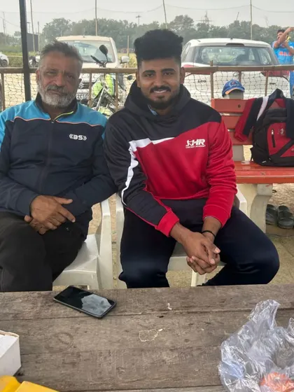 A photo with one of my senior players. It's a privilege to guide these young men on their cricket journey.