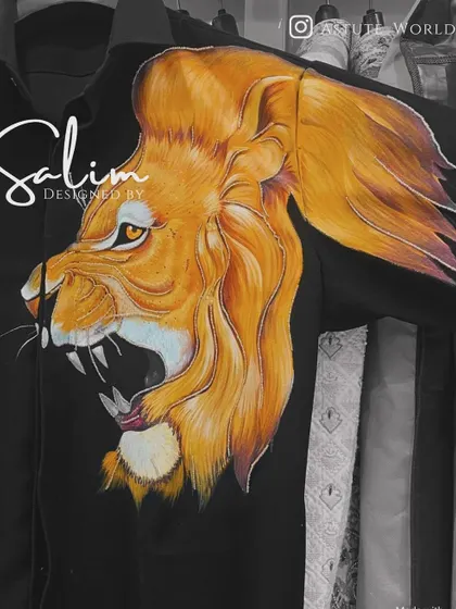 A close-up of a hand-painted roaring lion on a black shirt. The detail and color blending showcase the high level of artistry I bring to my custom pieces.