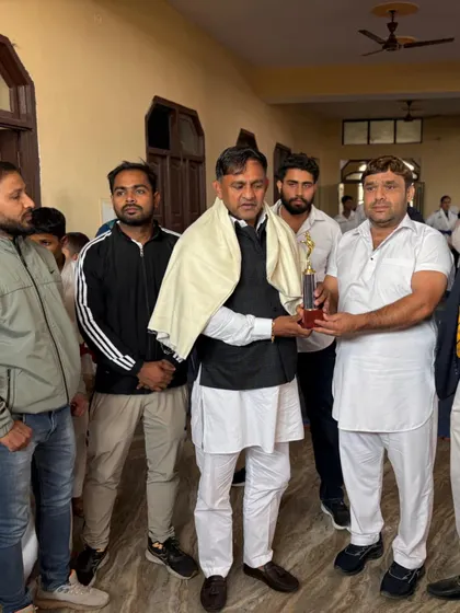 Presenting a trophy at a local championship. It is my duty to encourage and recognize the hard work of all athletes.