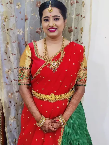 The full look, showing the beautiful half-saree and how the makeup and jewellery complete the traditional attire.