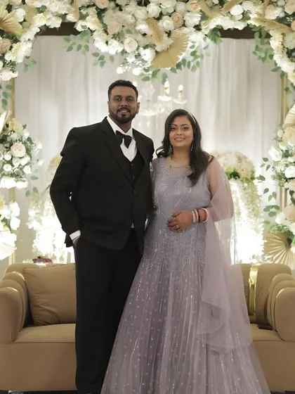 A full-length shot showing the complete look. Her sparkling lavender gown is perfectly complemented by the glamorous makeup, making her look and feel like a star.