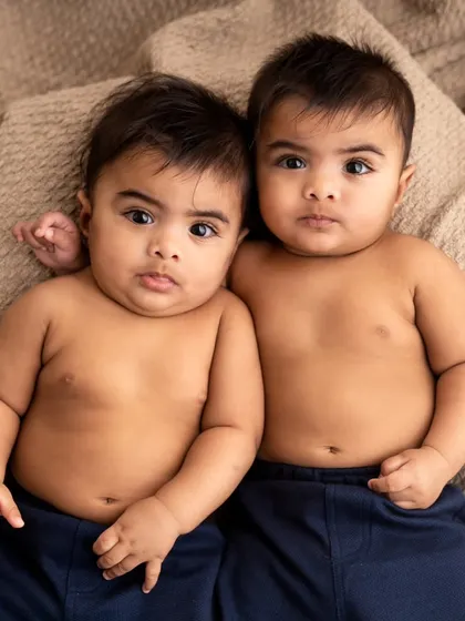 Look at these two! This portrait of six-month-old twin brothers shows that I also capture milestone sessions as your babies grow. Their curious expressions are just priceless.