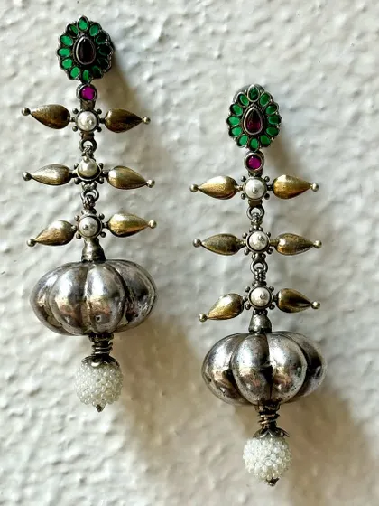Can anything be more beautiful than pure silver Indian earrings? This pair features a unique tiered design with pearl drops, combining oxidised and polished silver for a striking look.
