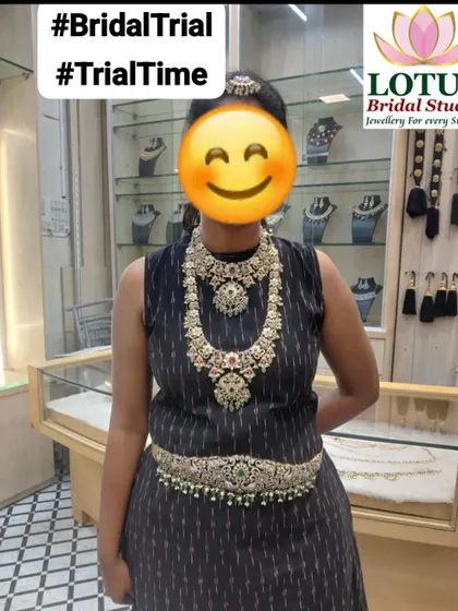 A client trying on a beautiful uncut stone, or Kundan, jewellery set during her bridal trial. Trying pieces on is essential to finding the perfect fit.
