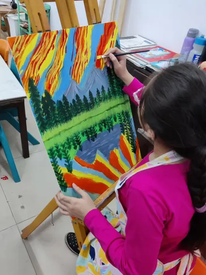 Follow a student's progress on a vibrant landscape painting, showing the development from a simple sketch to a fully colored and detailed scene.