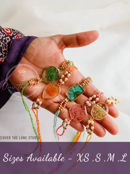 My handmade Rakhi collection is available in sizes from XS to L. Each one is crafted with real preserved flowers, making it a unique and beautiful symbol for Rakshabandhan.