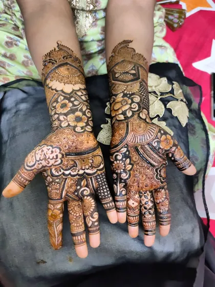 A beautiful design with a mix of floral and traditional patterns, perfect for any festive occasion.