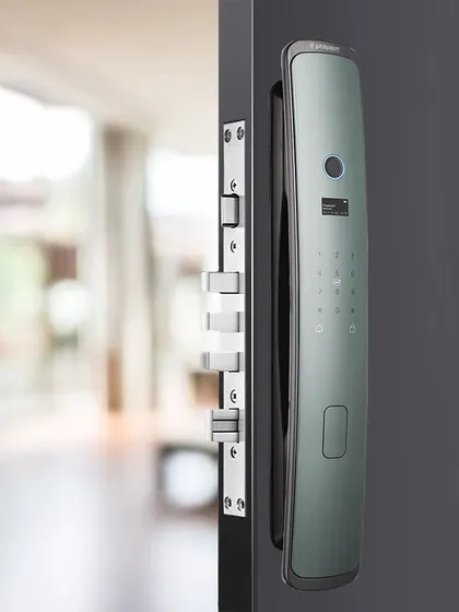 This sleek, silver-finished smart lock offers a futuristic aesthetic. Its curved design and integrated fingerprint sensor provide a comfortable and stylish way to secure your home.