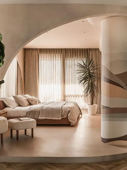 The master suite in the "Marshmallow" penthouse, where we combined two bedrooms to create a free-flowing, uninterrupted space defined by curved volumes and natural light.
