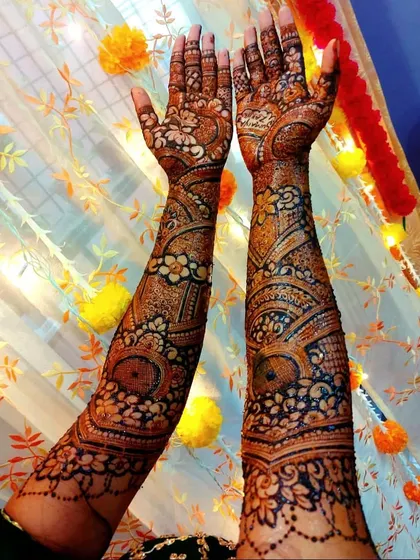 One of my favorite bridal sessions, featuring elaborate floral work that flows from the palms up the arms. The dark paste promises a beautiful stain.