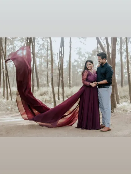 A walk in the woods turned into a fairytale. The deep wine-colored trail gown adds a touch of romance and drama to this couple's lovely pre-wedding photoshoot.