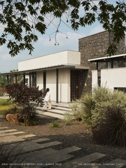 The entrance to Pavilion House, as featured in The Architect's Diary. The combination of local basalt stone and clean white walls creates a welcoming and modern first impression.