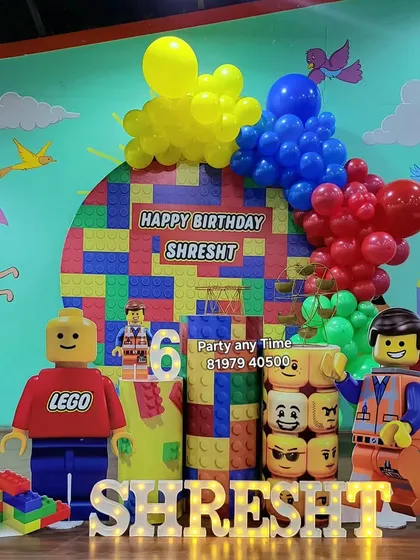 A clear, bright photo of the Lego theme for Shresht's 6th birthday.