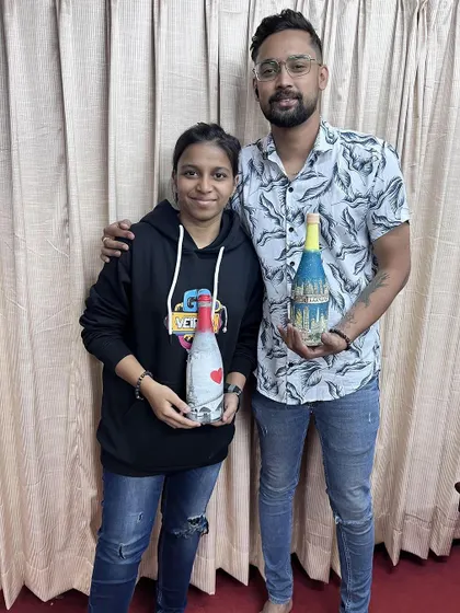 Another happy couple after a private bottle painting session. It's a fantastic activity for anniversaries, date nights, or just for fun.
