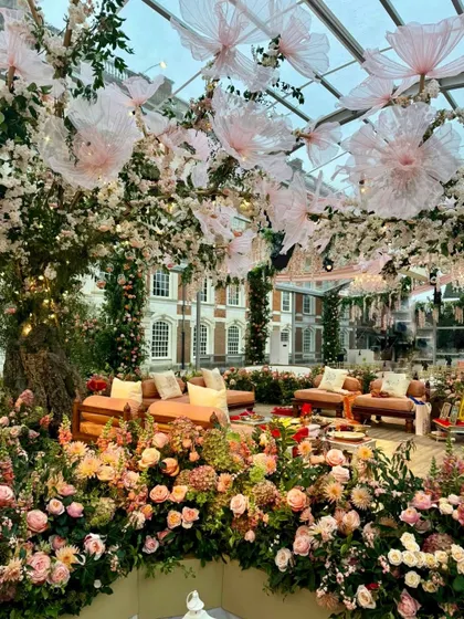 More glimpses of the English countryside celebration, showing the floral-draped entrance, the grand marquee tent, and the charming ice cream truck.
