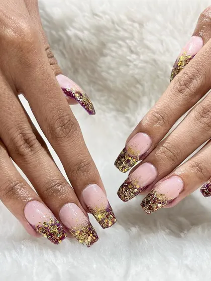 A beautiful set of glitter-encapsulated French tips. Our courses cover techniques for embedding glitter and other elements into acrylic and gel for a flawless finish.