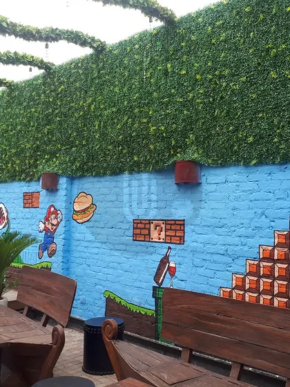 A fun, retro Super Mario themed mural for the outdoor area of Walking Street in Gurgaon. We recreated the iconic video game level on a brick wall, creating a nostalgic and playful atmosphere.